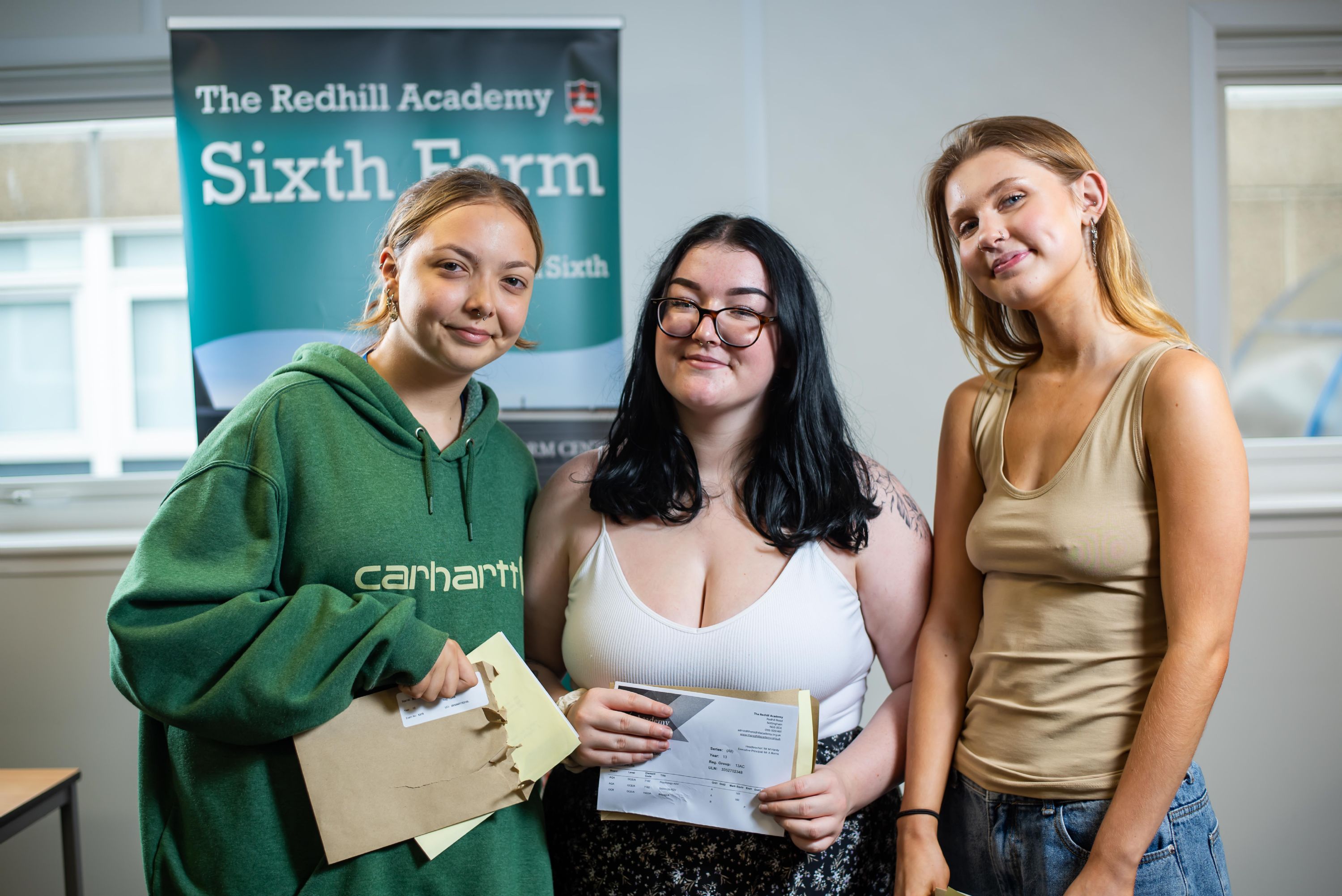 Pictured (left to right): Milly Bartlam – receiving two A*s and an A, Morgan Delton, receiving two As and a B, and Gwen Addleton, receiving two A*s and an A.